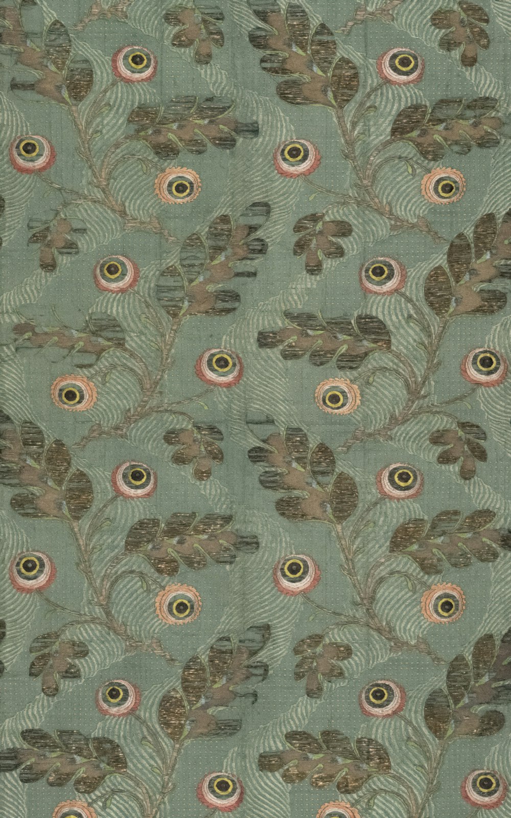 a pattern of feathers and leaves on a green background