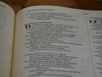 An open page of a religious text, likely from the Bible, is visible with headings and verses. The text includes significant lines such as 'God's love for Israel' and contains numbered verses. The page number 681 is printed at the top.