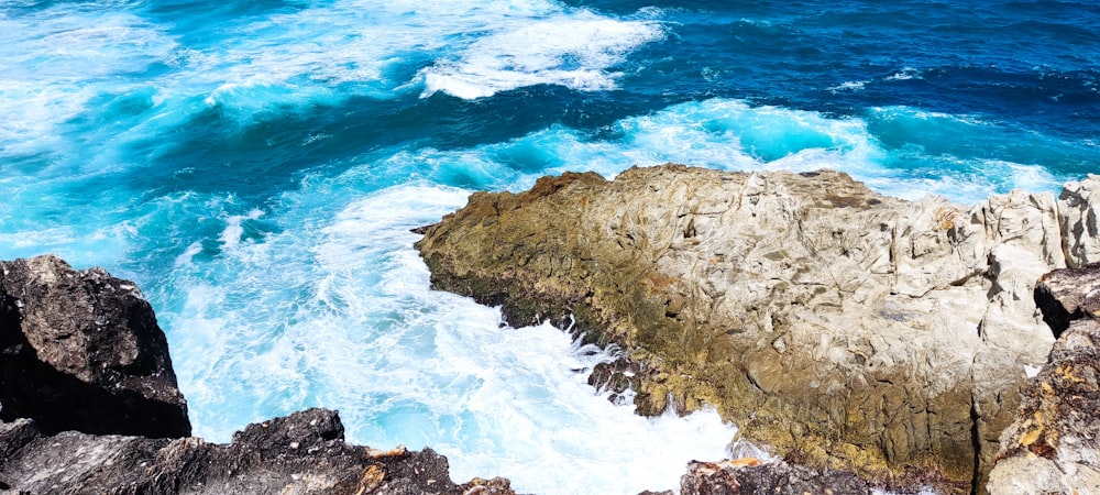 a view of the ocean from the top of a cliff