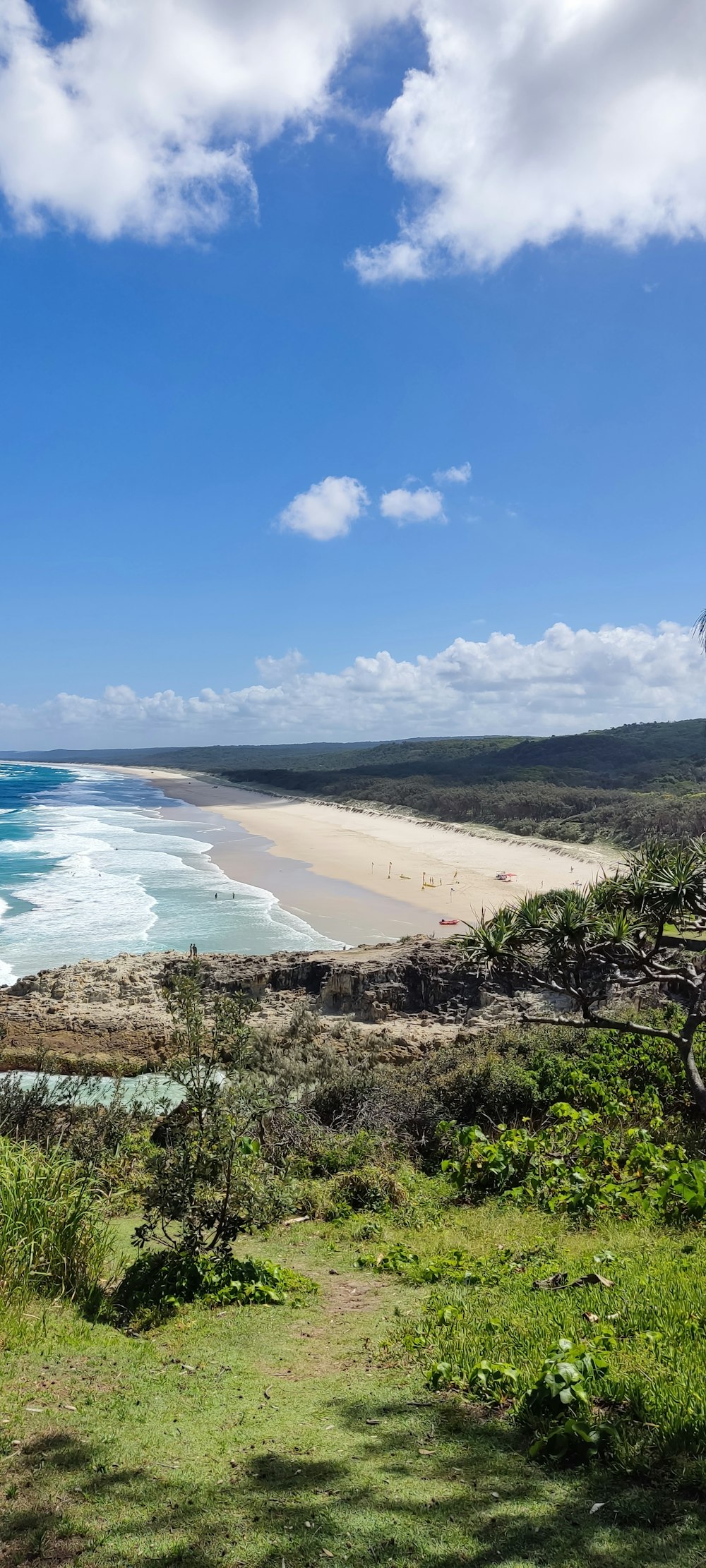 a view of a beach from a hill