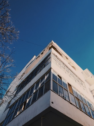Wide shot of a building with half-cleaned facade showing before and after.