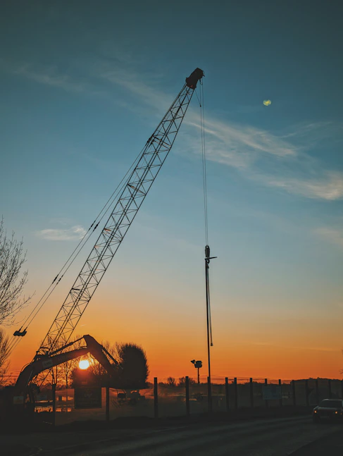 a large crane sitting on top of a street