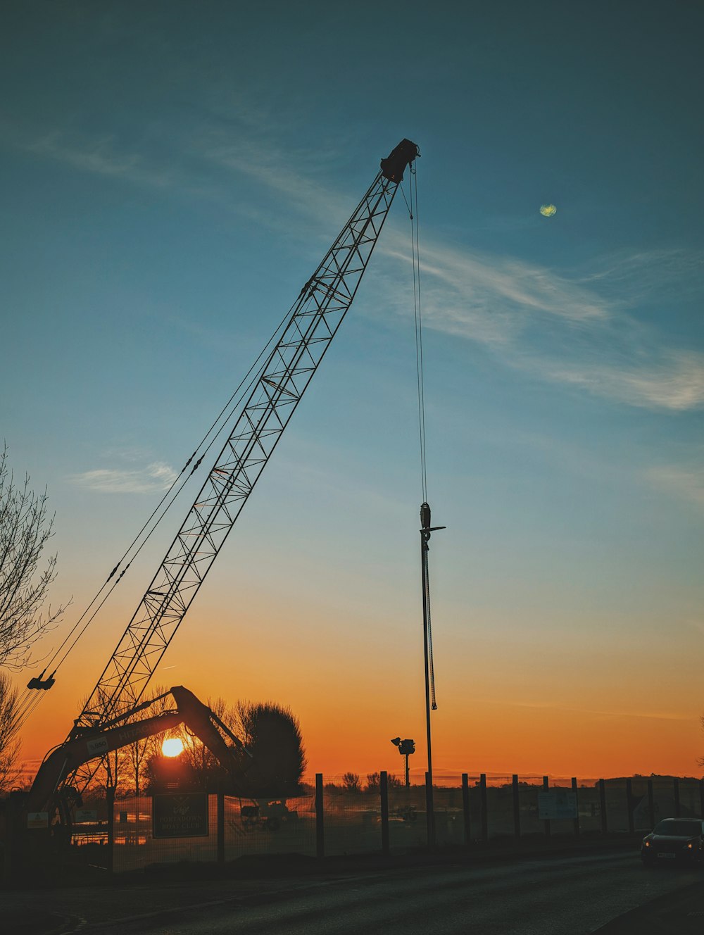 a large crane sitting on top of a street