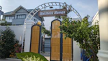 The welcoming entrance of Dr. Fasal's Homeo Clinic with a clear signboard and lush greenery.