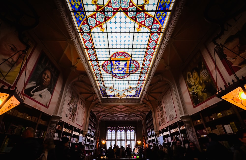 a large room with a skylight and stained glass ceiling