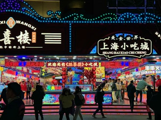 Colorful food stalls offering a variety of delicious street food at a festival.