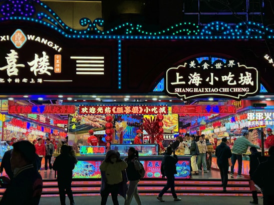 Colorful food stalls offering a variety of delicious street food at a festival.