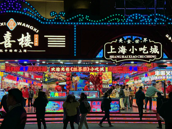 A vibrant street food stand bustling with happy customers enjoying fresh meals.