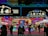 A vibrant street food market scene showcasing diverse food stalls.