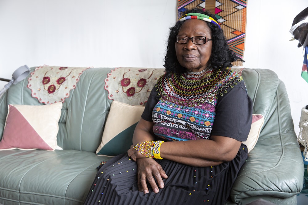 a woman sitting on a couch in a room