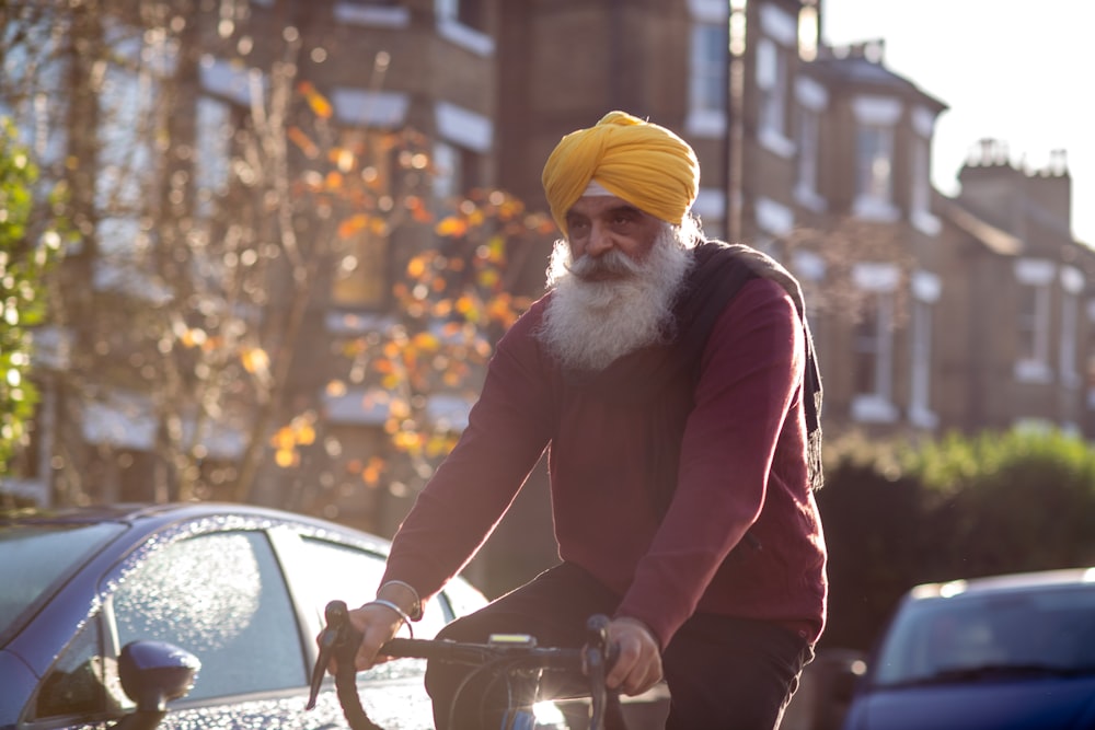 a man with a turban on riding a bike