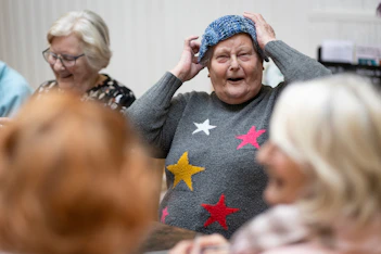 a woman covering her head with her hands