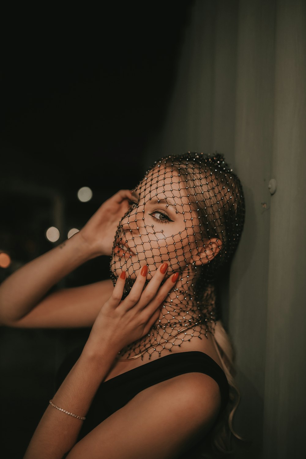 a woman with a veil on her face