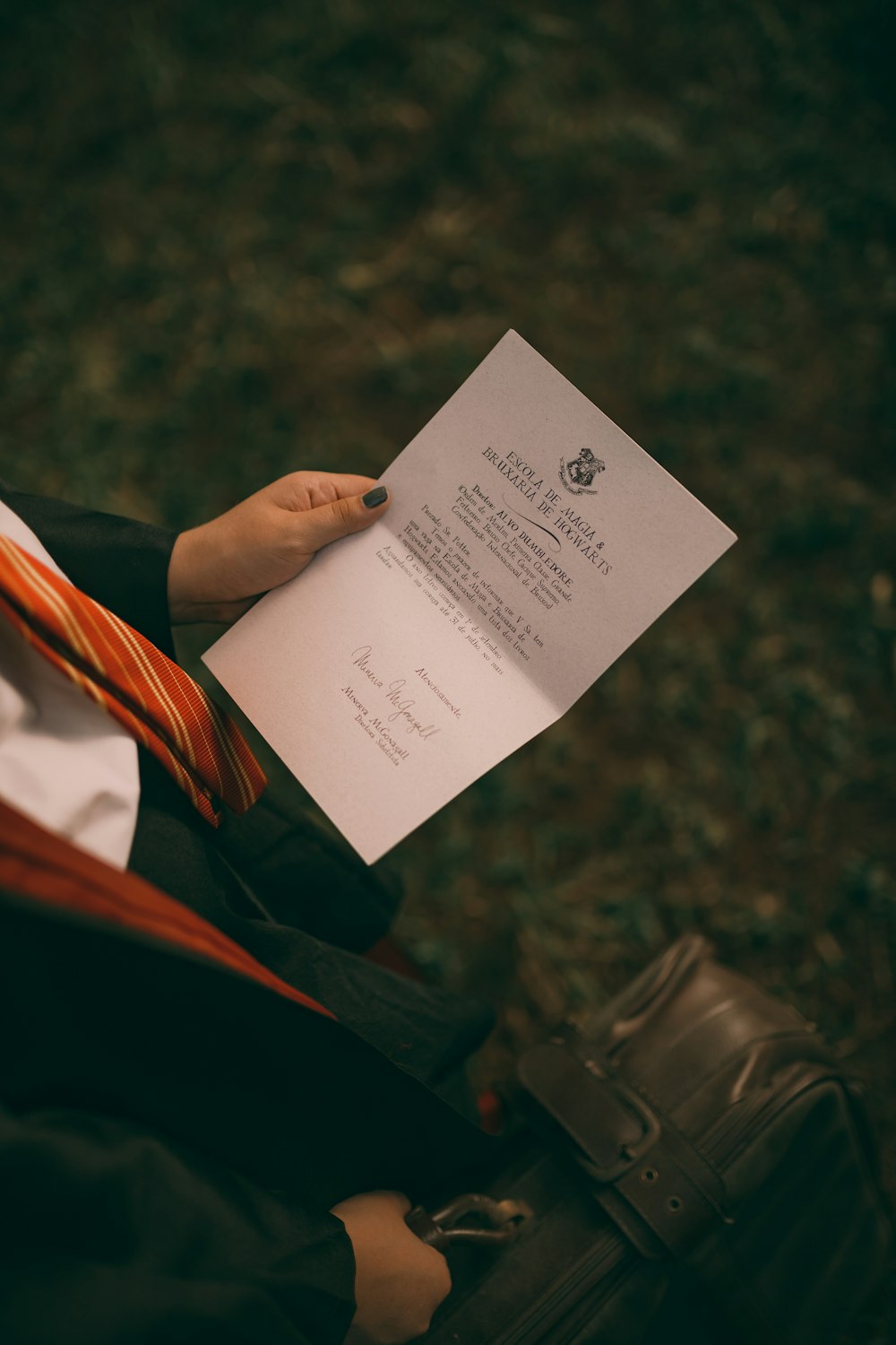 a person holding a piece of paper in their hand