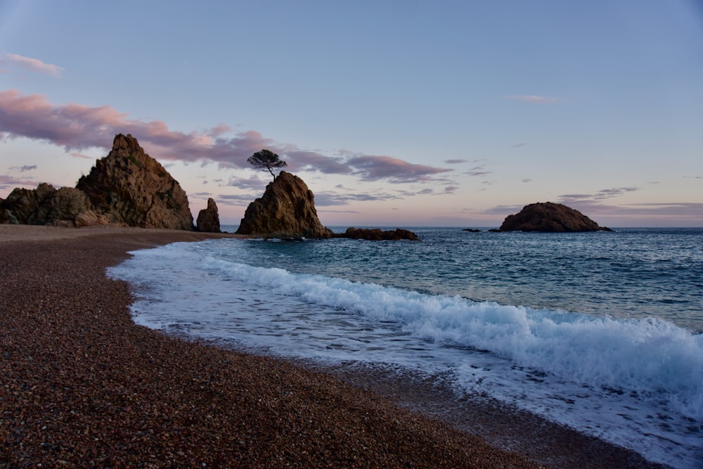 a beach with waves coming in to the shore