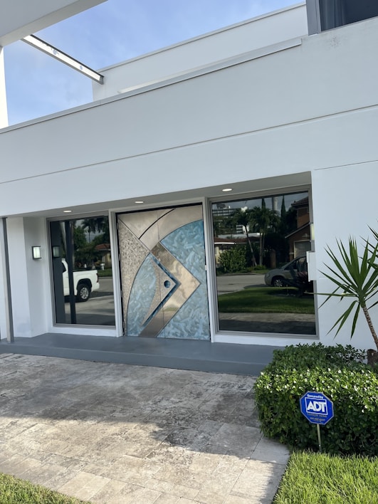 A sturdy steel front door installed on a modern home entrance.