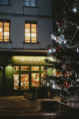 A small business owner proudly opening their new shop with a MAS Solutions sign.