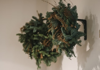 a wreath hanging on a wall next to boxes