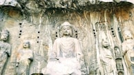 Close-up of the intricate stone carvings at Gal Vihara, highlighting the Buddha statues.