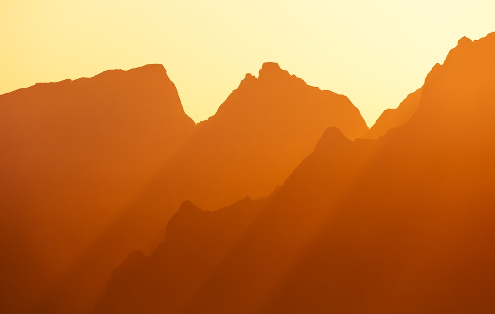 a view of a mountain range at sunset