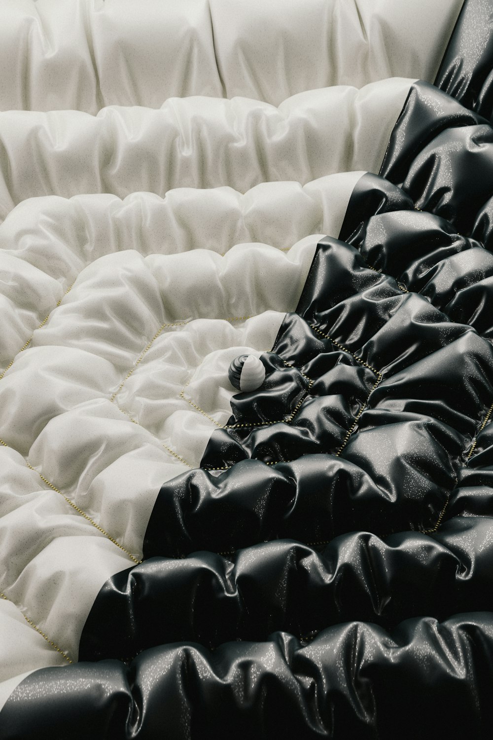 a black and white bed with a black and white comforter