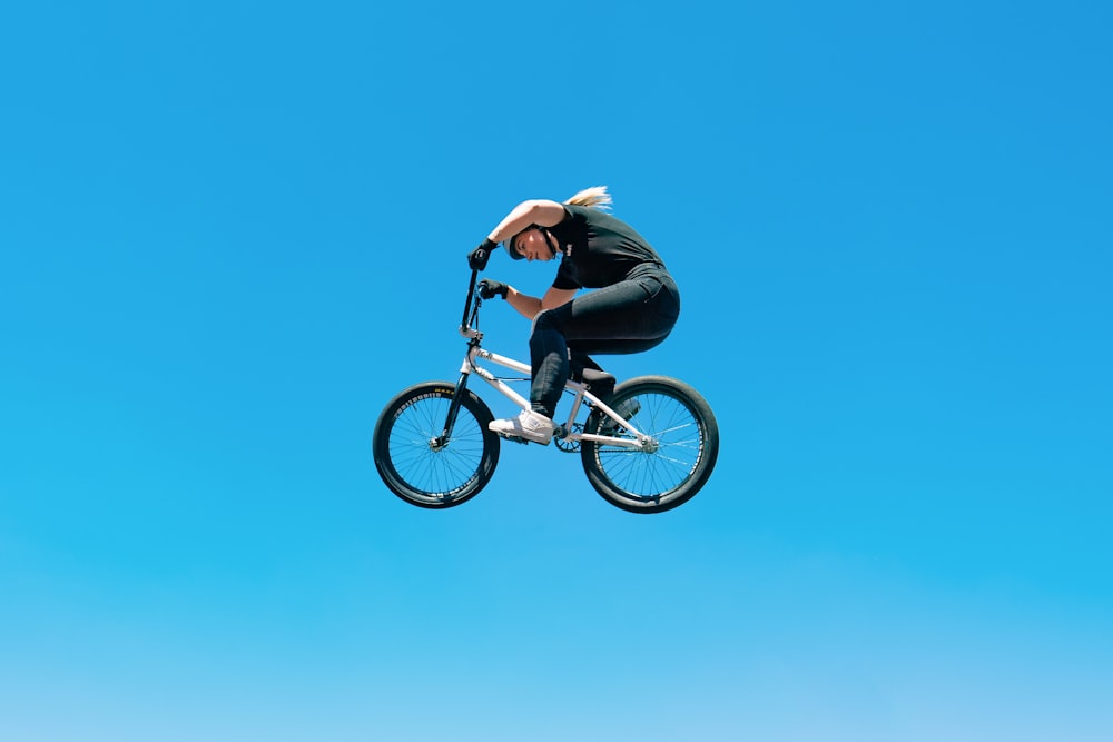 a person jumping a bike in the air