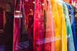 A vibrant display of colorful, stylish tops arranged to highlight their bold patterns and cuts.