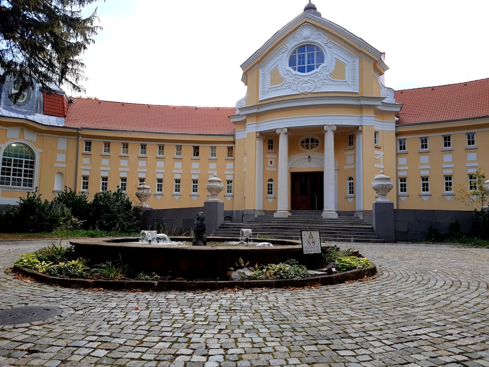 a building with a fountain in front of it