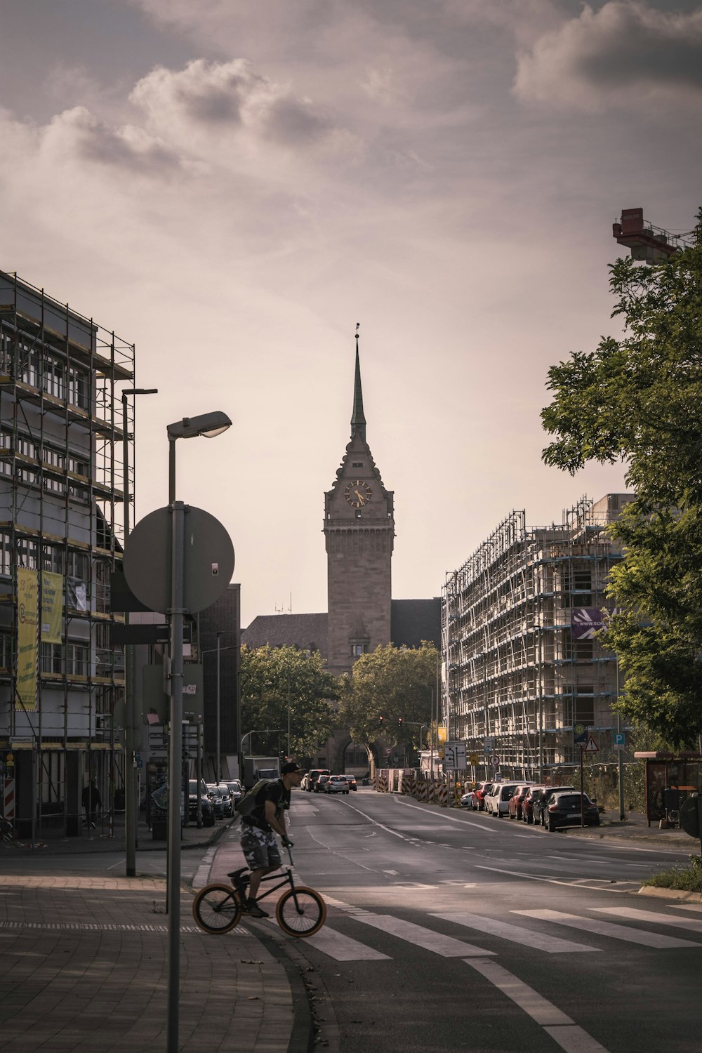 a person riding a bike on a city street