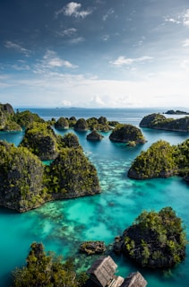 an aerial view of a lagoon with many small islands