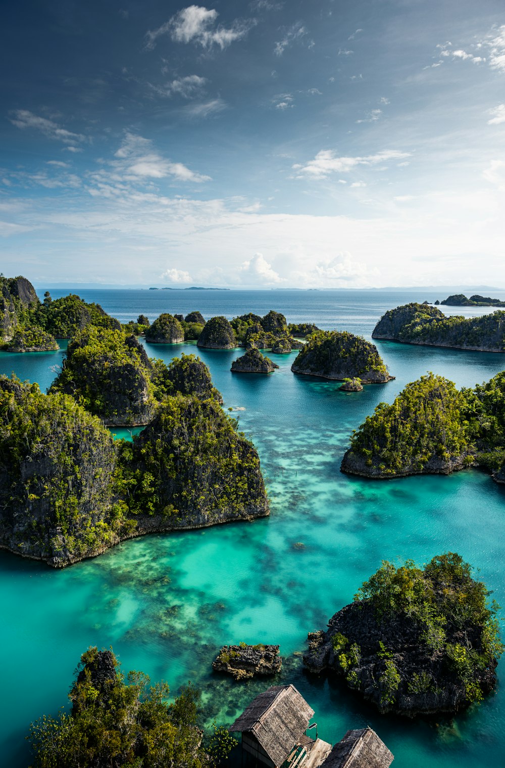 an aerial view of a lagoon with many small islands