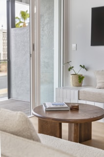 a living room with a couch a table and a tv