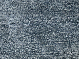 Close-up of rich navy twill fabric with fine weaving detail.