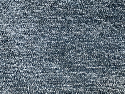 Close-up of lightweight, breathable fabric with a subtle blue tone.
