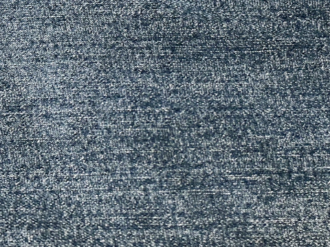 Close-up of rich navy twill fabric with fine weaving detail.