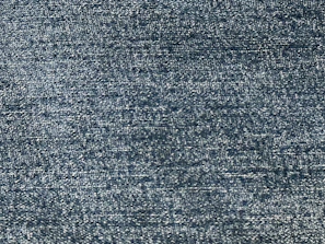 Close-up of rich navy twill fabric with fine weaving detail.