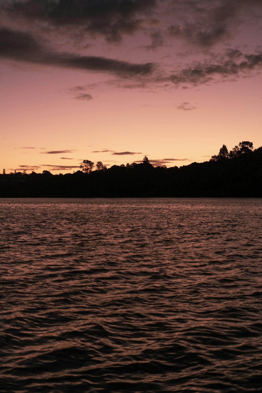 a body of water with a boat in the distance