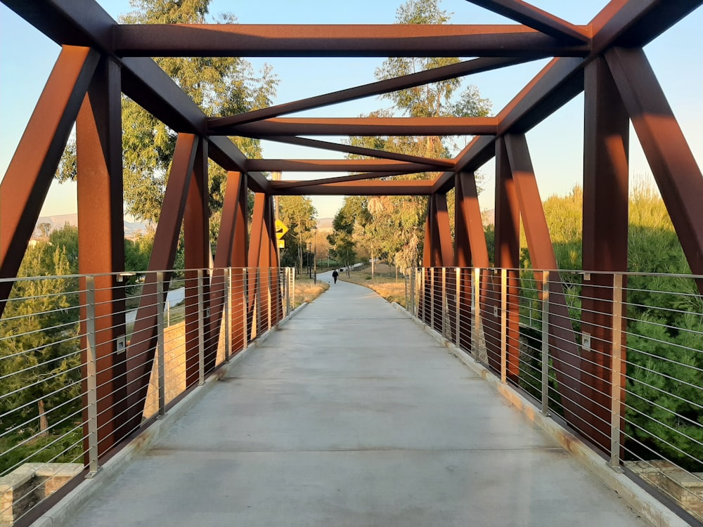 a bridge with a person walking across it