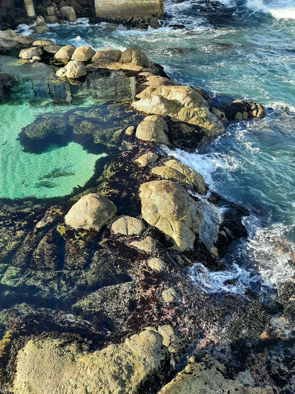 a large body of water surrounded by rocks