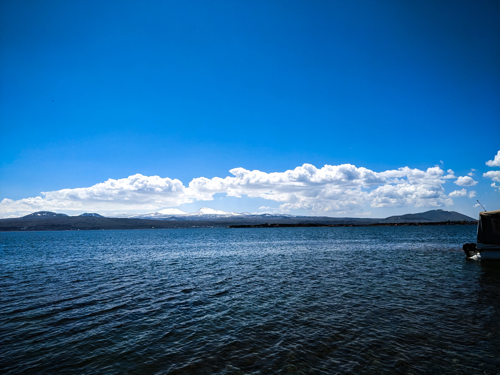 a boat floating on top of a large body of water
