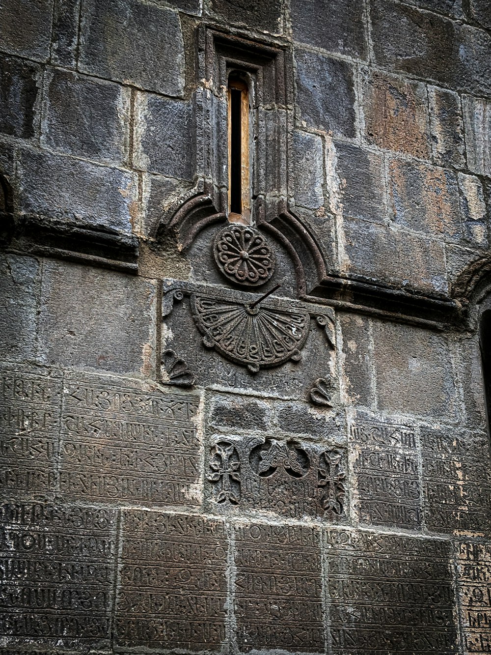 a close up of a stone building with a window