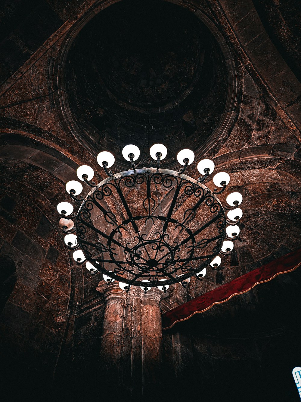 a circular light fixture in a dark room