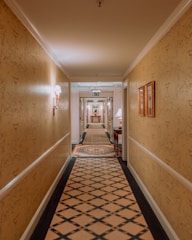 View of the hotel hallway leading to the Queen Suite entrance.