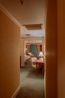 Cozy hotel room with warm lighting and elegant decor.