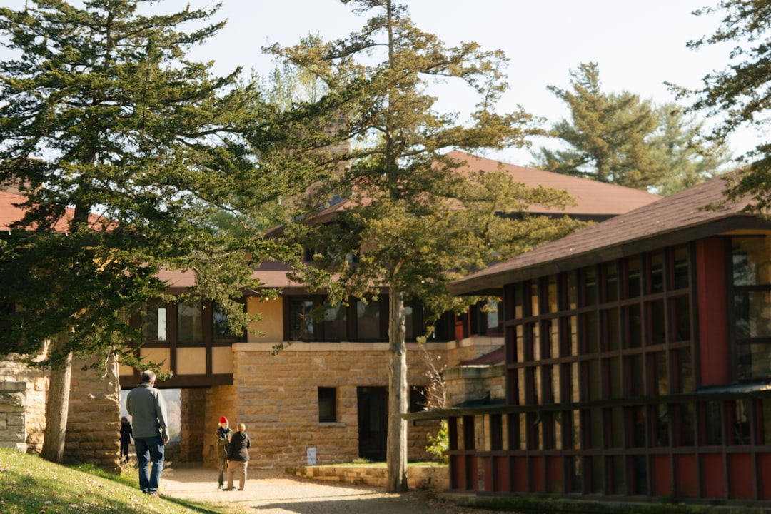residential treatment facility exterior with people walking peaceful grounds