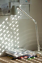 A sparkling clean office desk with sunlight streaming through the window.