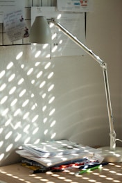 A bright morning scene with sunlight streaming through a window onto a cozy desk.