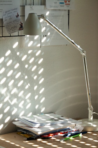 A caring medical expert consulting documents in a sunlit office.