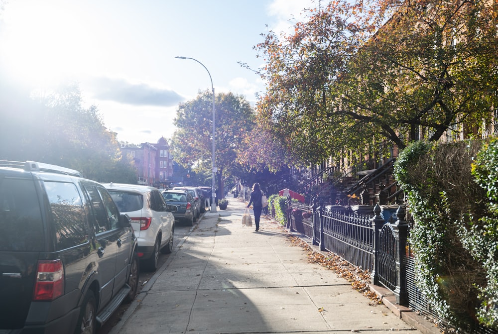 a line of parked cars on a city street