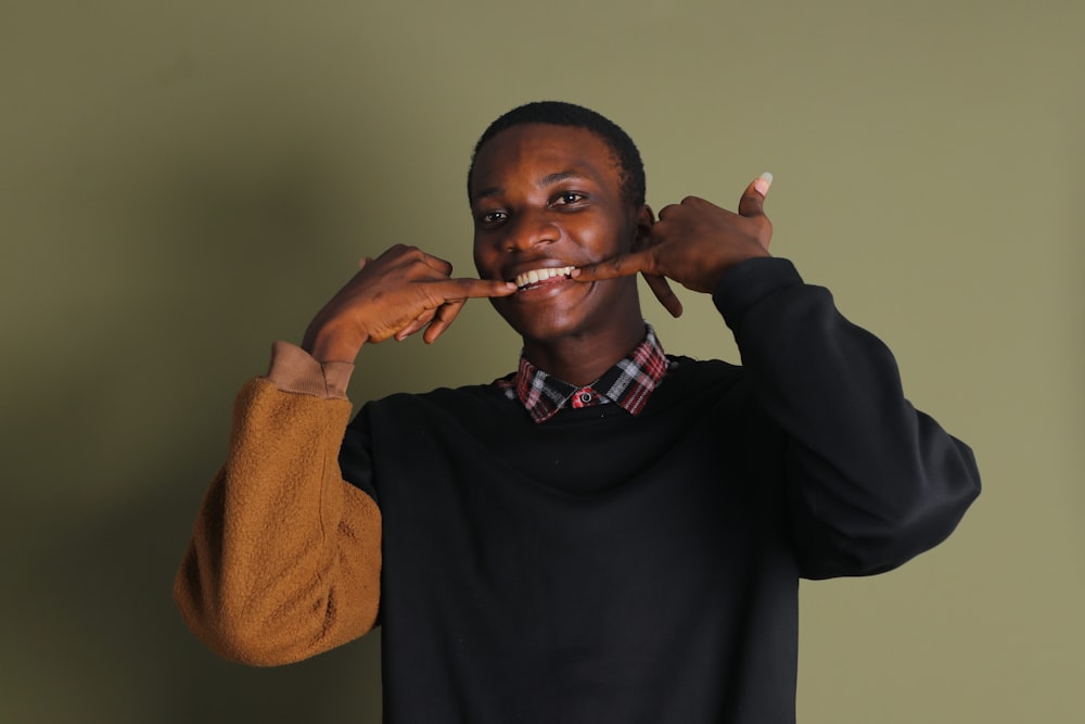 a man brushing his teeth with a toothbrush